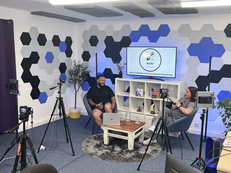 Relaxed business conversation being filmed in professional video production studio